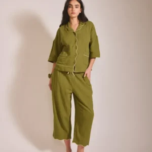 Model wearing TBCo Cropped Cotton Pyjamas in Green with yellow piping, front view, gallery position 1 portrait image