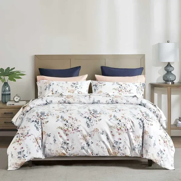 Camille duvet cover set in watercolor floral print with pink-peach blooms and blue-grey foliage on white, 300 thread count cotton sateen