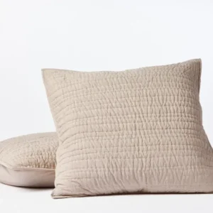 Coyuchi Channel Handstitched pillow sham in natural linen with quilted stitch detailing, two sizes shown.