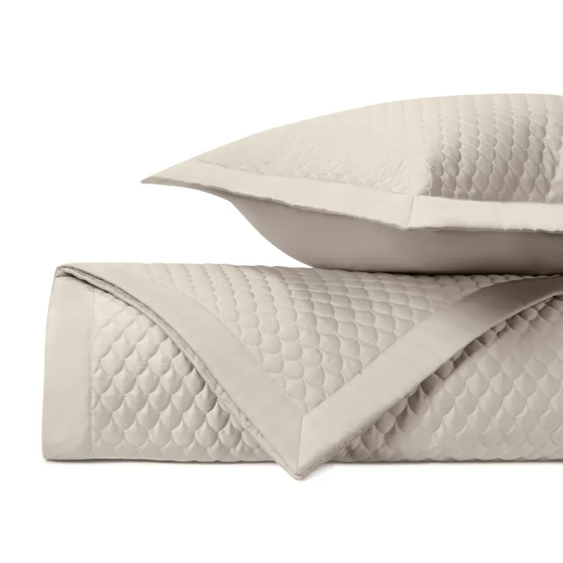 Home Treasures Raindrop quilted coverlet and euro sham set in ivory with scallop pattern.